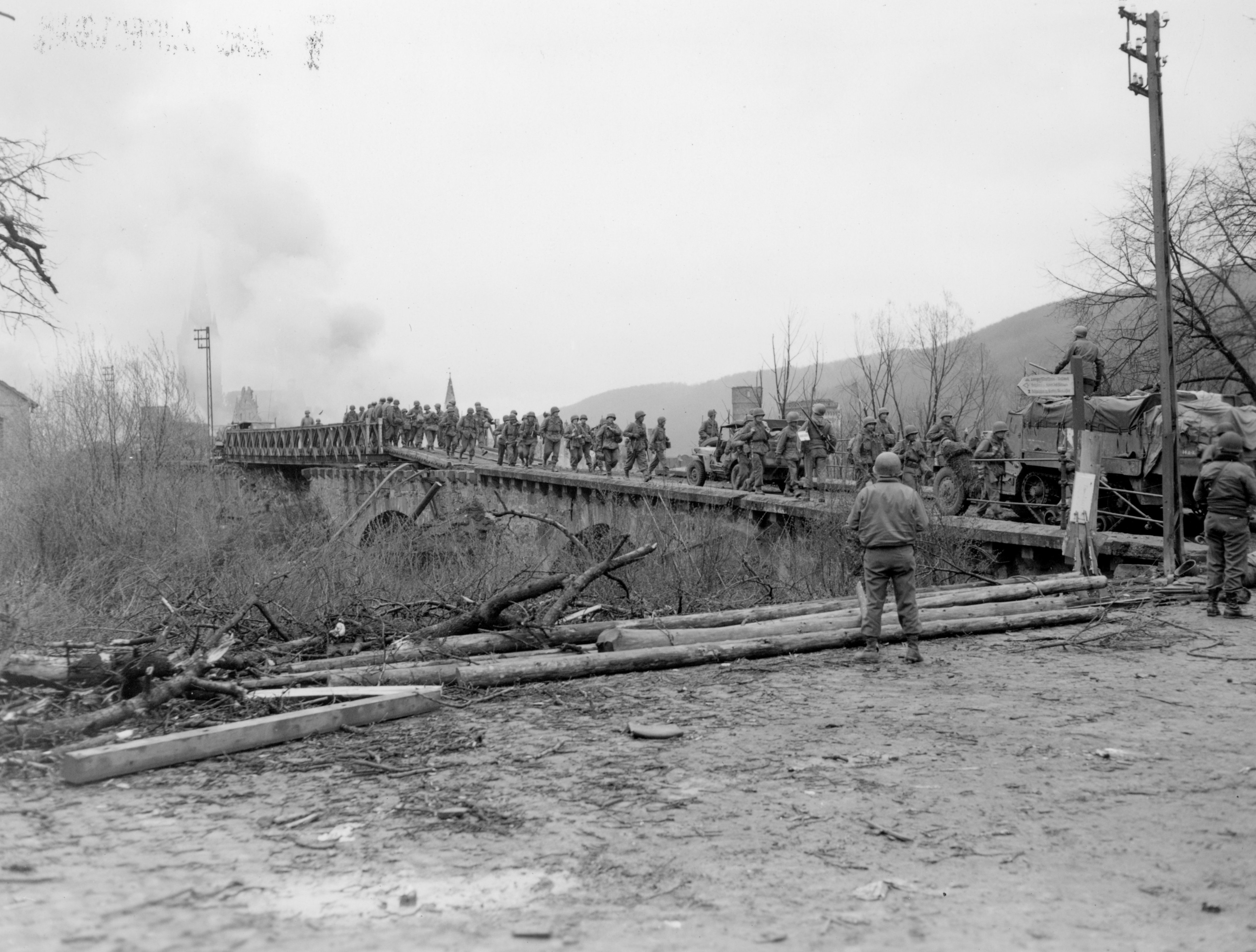 US soldiers crossing a footbridge