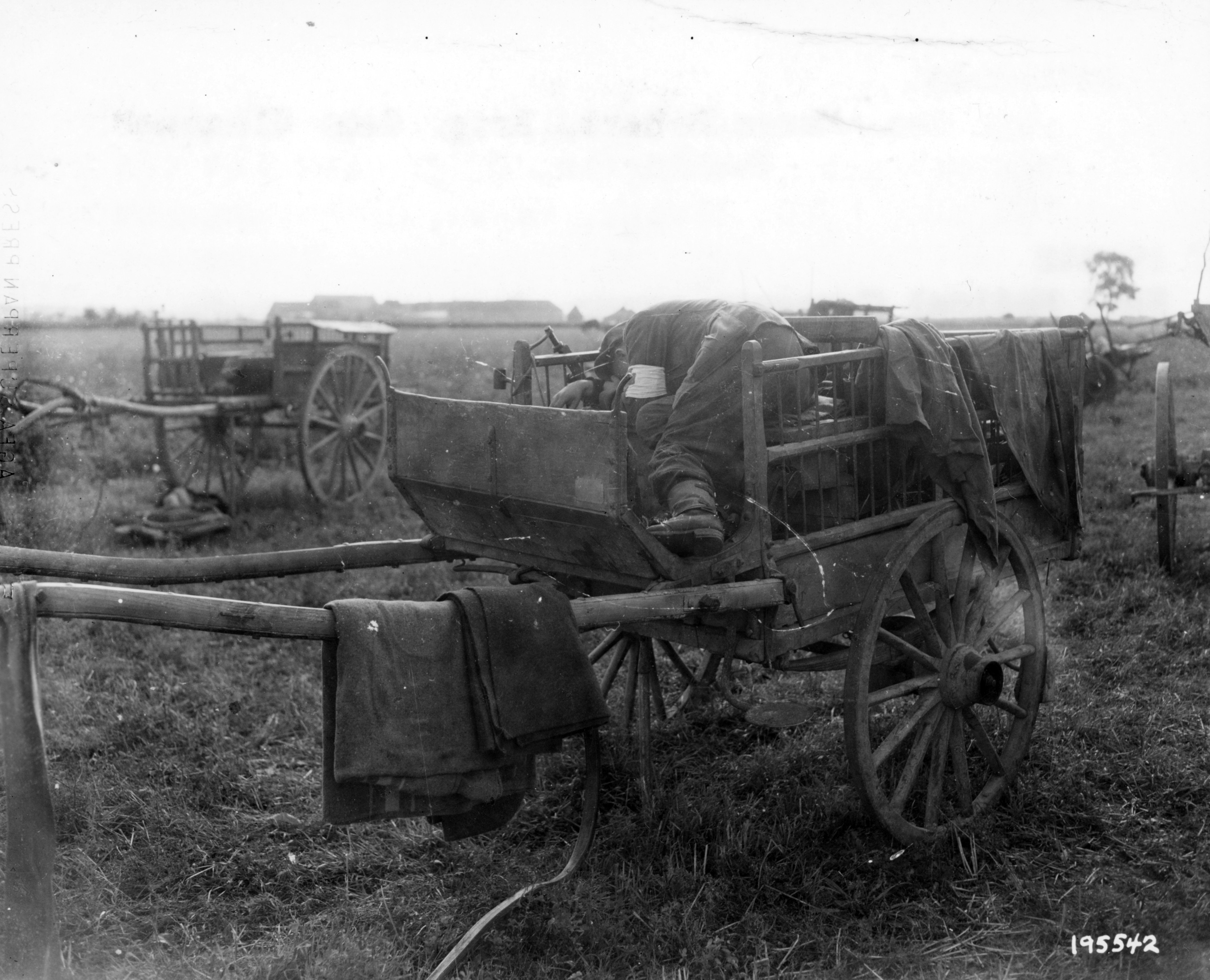 Wounded German in a wagon somewhere in France.