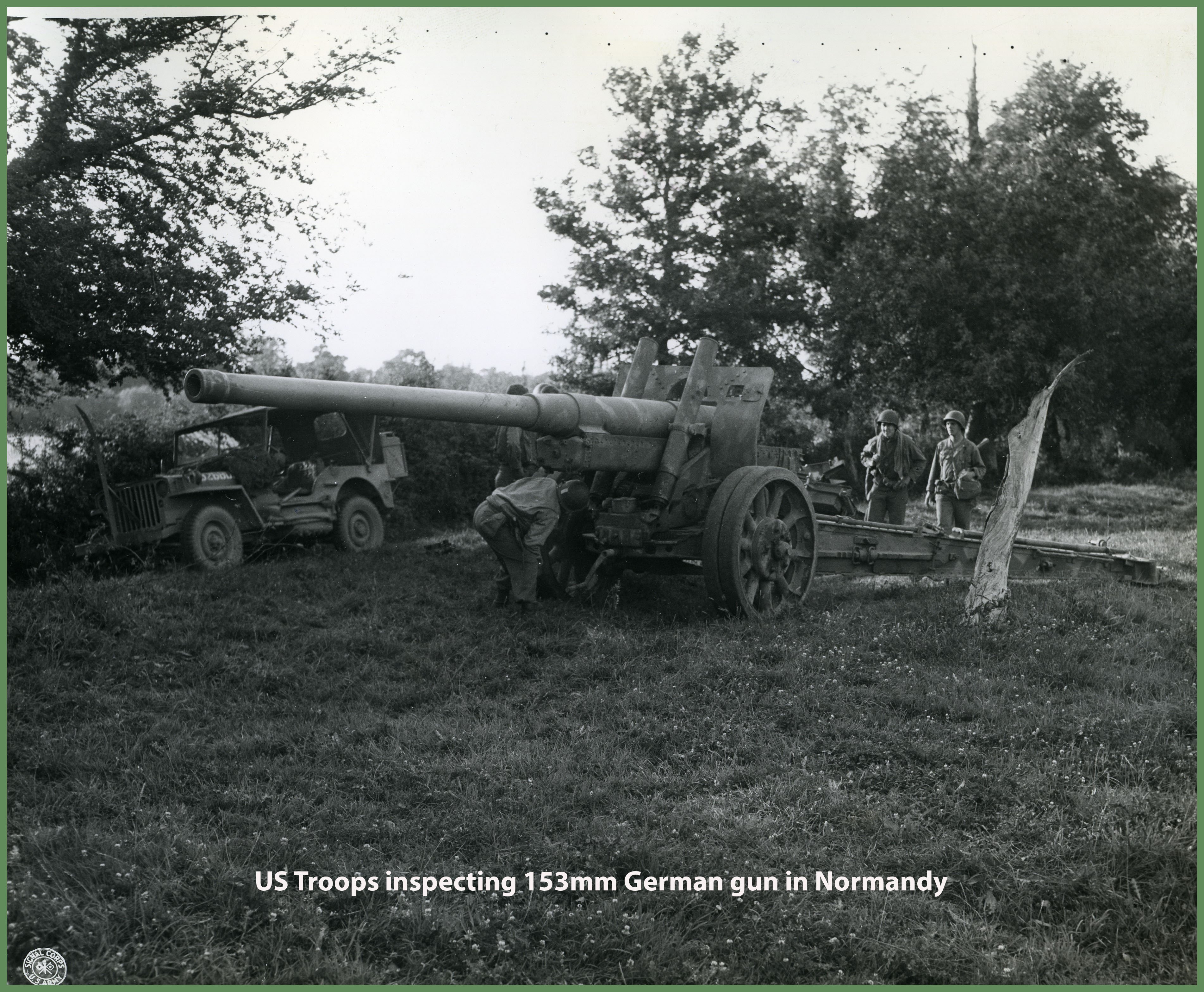 US Troops inspecting a German gun 