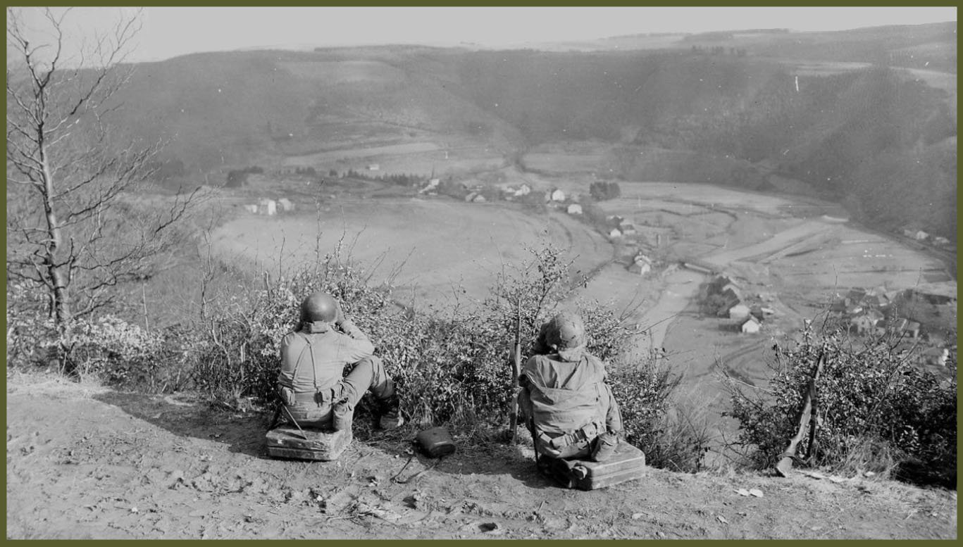 Artillery observation men with the 11th Armored Division, 3rd Army, direct gun crews working in nearby Peterskirche, Belgium. 22nd Tank Battalion, 11th Armored Division, Tusa Peterskirche, Belgium.