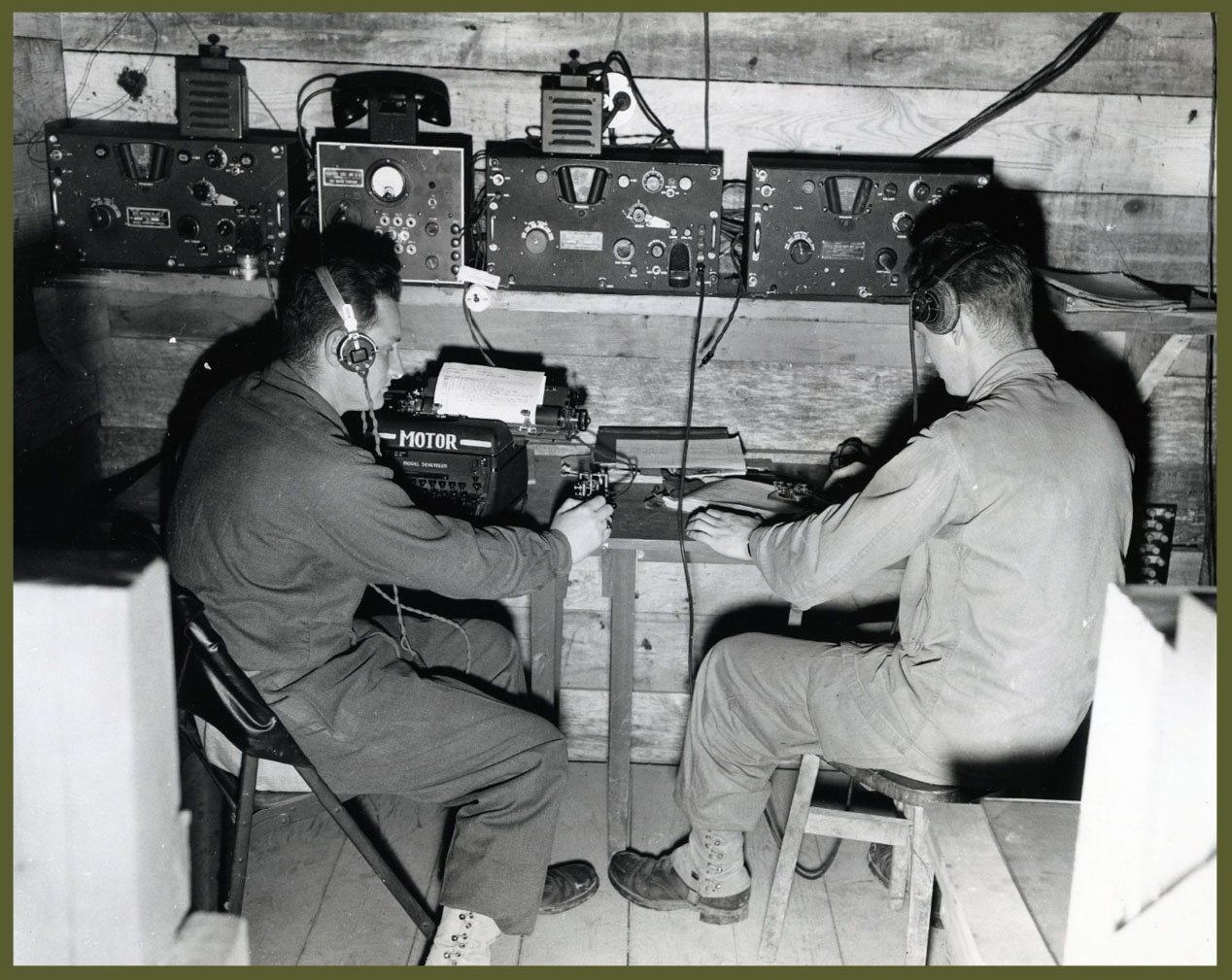 Radio shack in a foxhole at the Omaha beach command