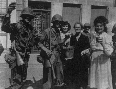 79th Infantry Division men in Mantes-Gassicourt with locals