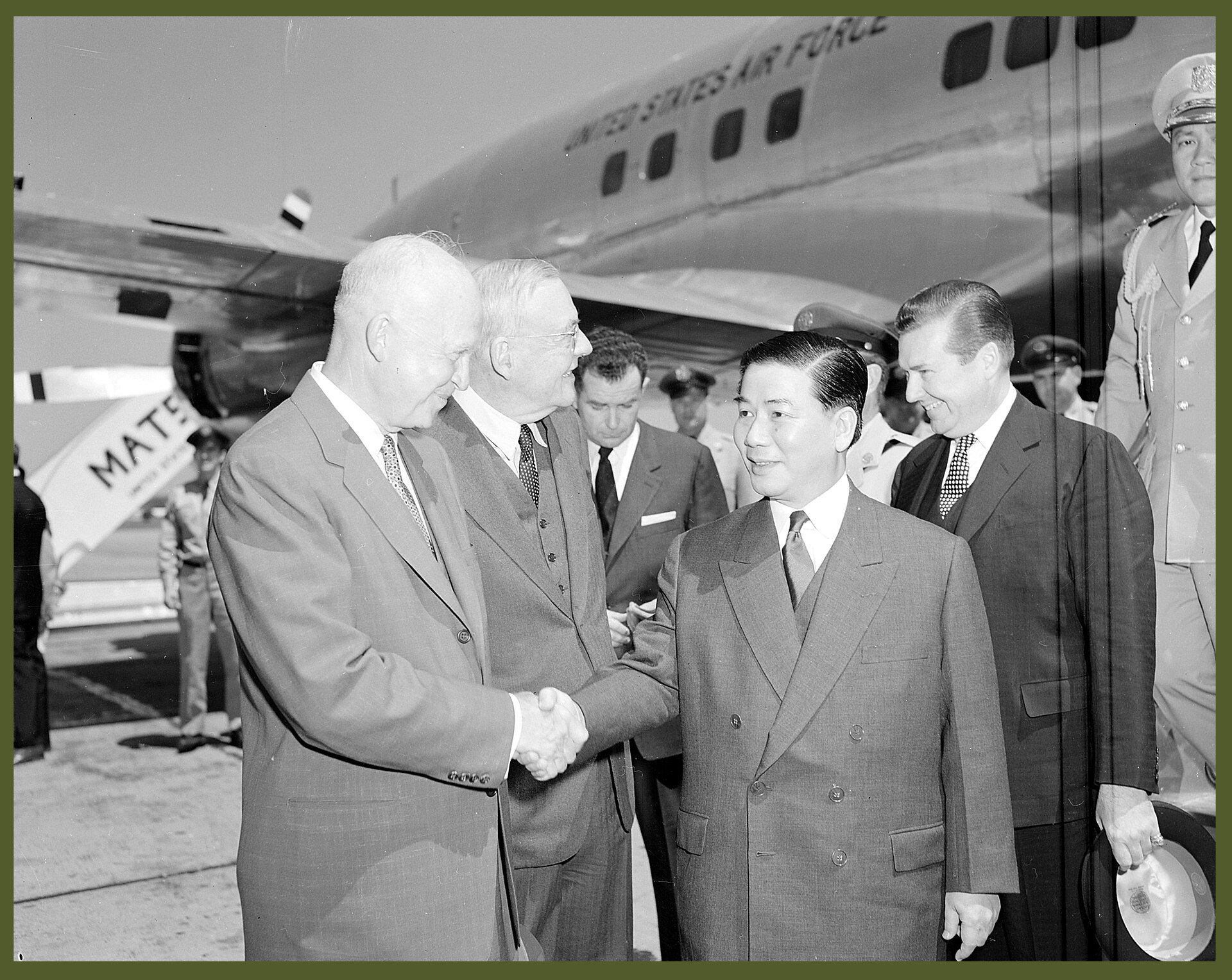 US President Dwight D. Eisenhower and Secretary of State John Foster Dulles (from left) greet South Vietnamese President Ngo Dinh Diem at Washington National Airport
