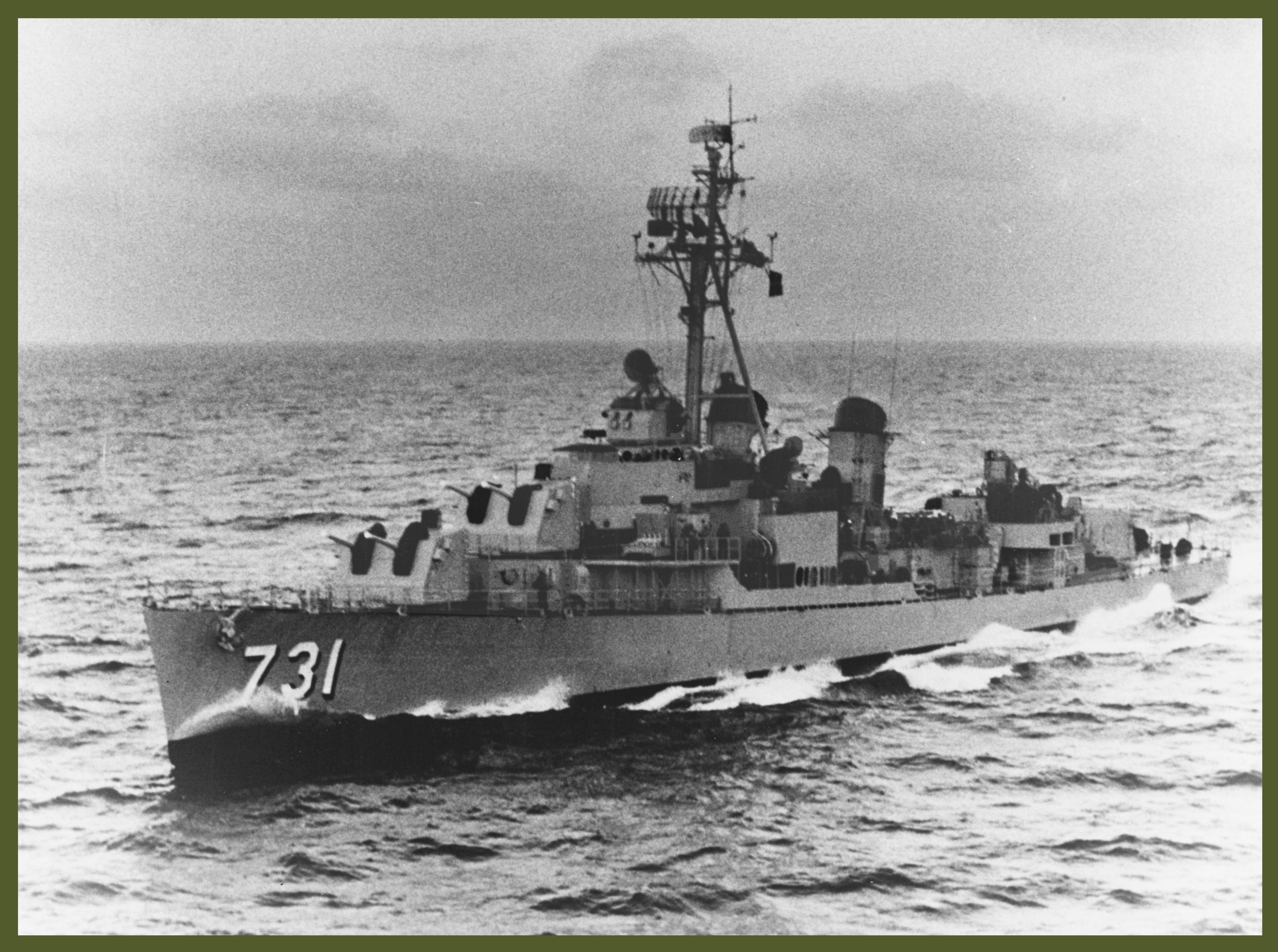 USS Maddox (DD-731) underway at sea, circa the early 1960s